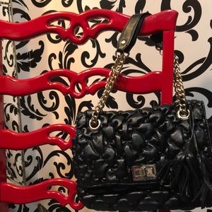 Black quilted purse with gold chain straps